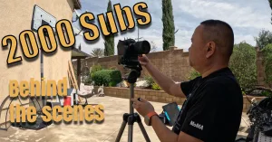 Guy fixing a camera on tripod