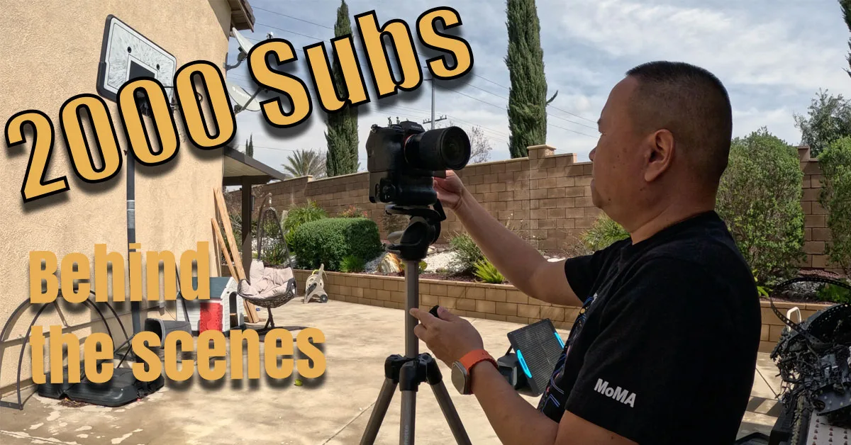 Guy fixing a camera on tripod