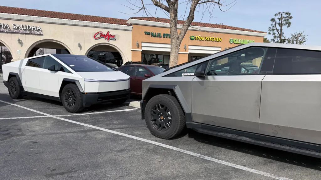 Two Tesla Cybertrucks parked together
