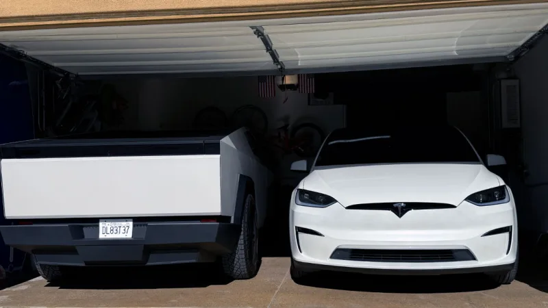 Two electric vehicles in garage