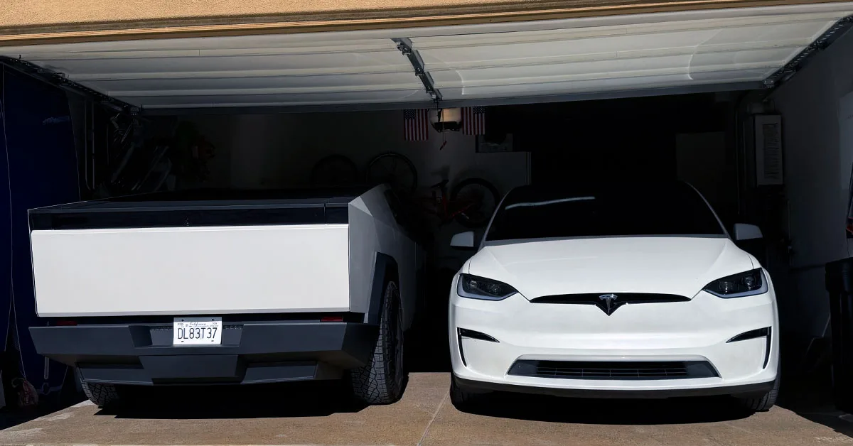 Two electric vehicles in garage