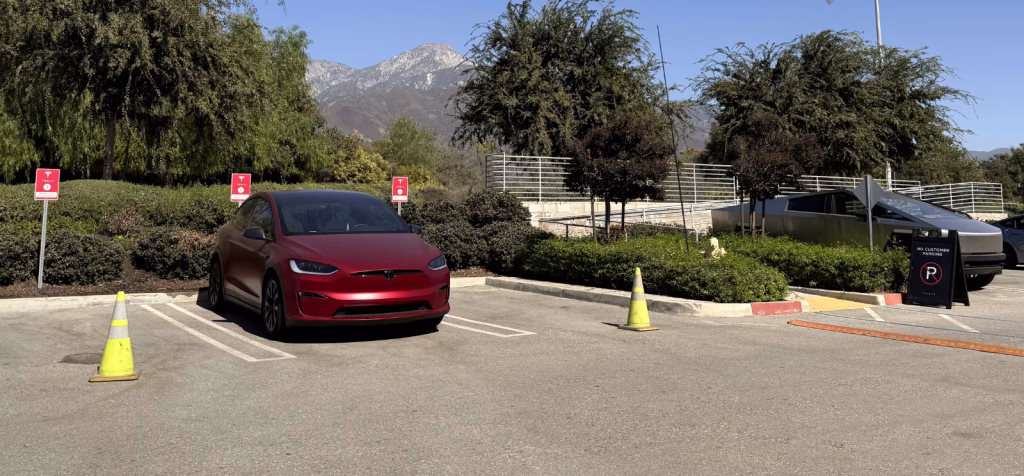 Model X Plaid next to Cybertruck at Tesla parking lot