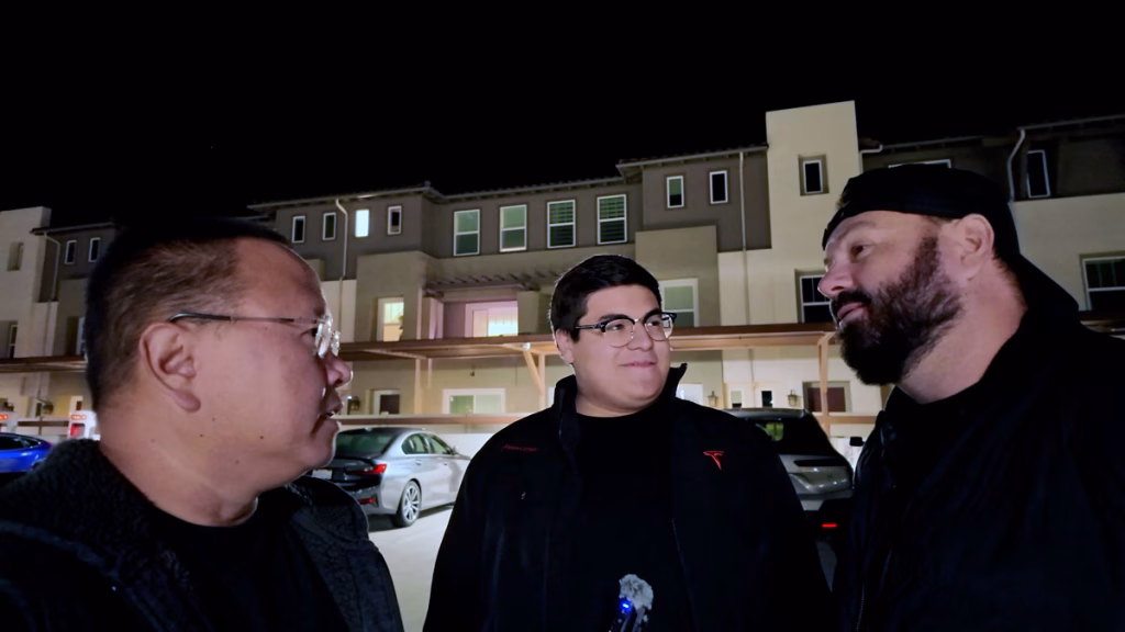 three guys talking around superchargers