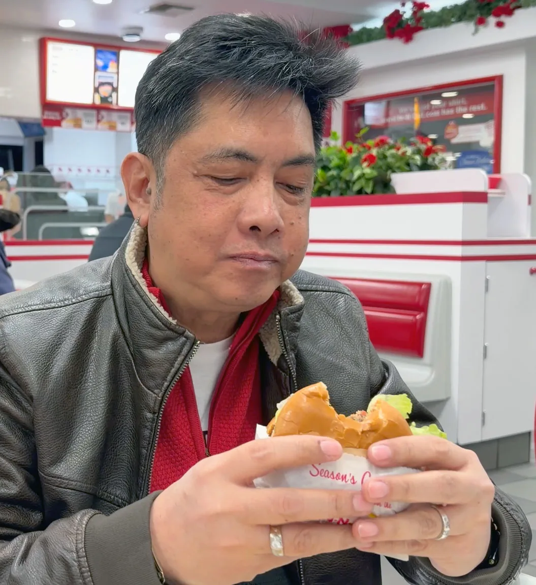Tito Henry enjoying In N Out burger