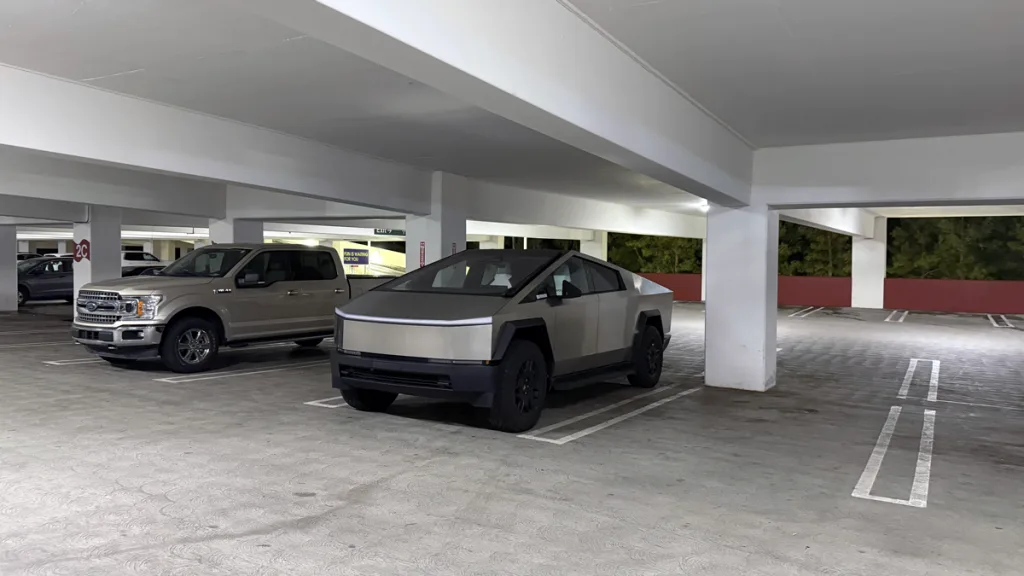 cybertruck parked next to f150
