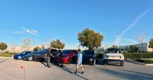 Walking in front of Tesla fleet and Rivian