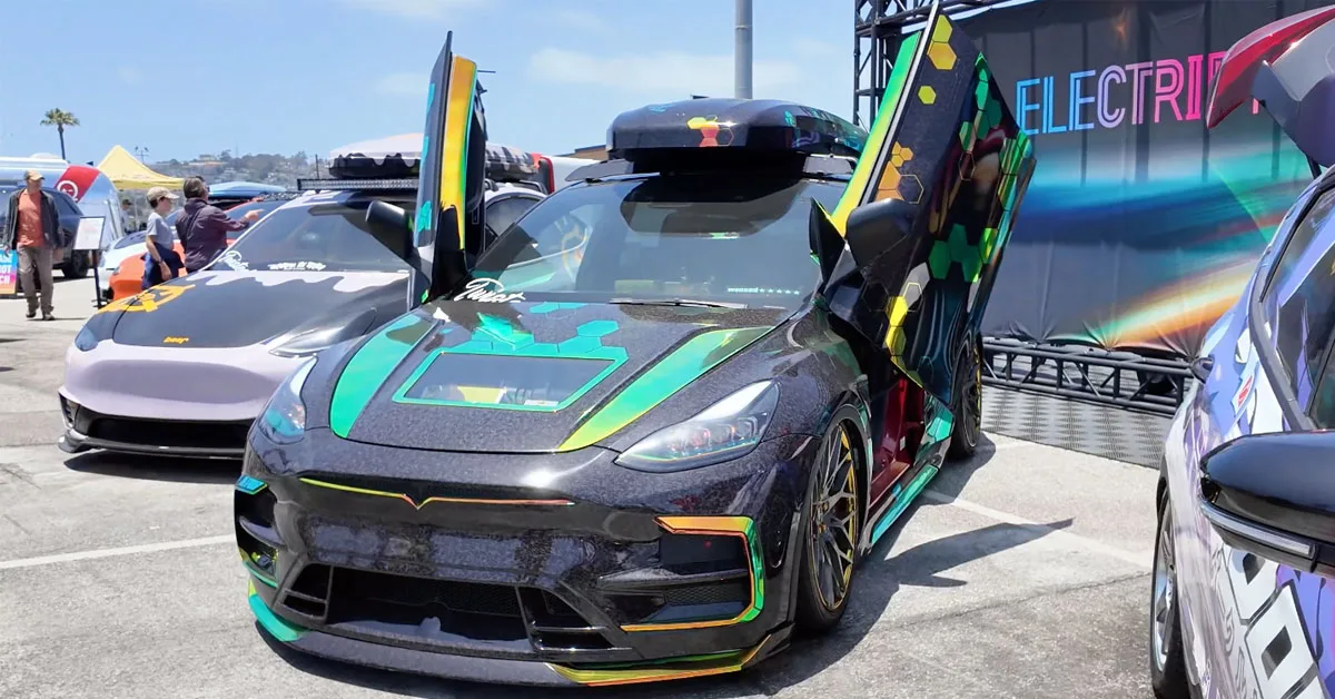 modified Model Y Performance with wrap and lift up doors